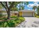 Charming single-story home with a well-manicured lawn and attached two-car garage at 314 Pembroke Ln # 189, Venice, FL 34293