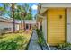 Charming front yard with lush landscaping and a quaint walkway to the entrance at 314 Pembroke Ln # 189, Venice, FL 34293