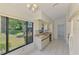 Bright kitchen with a large window offering scenic views of the well-maintained lawn at 314 Pembroke Ln # 189, Venice, FL 34293