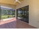A tiled lanai with screen enclosure offers peaceful outdoor living at 314 Pembroke Ln # 189, Venice, FL 34293