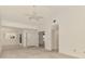 Bright living room featuring a ceiling fan, neutral tones, and plenty of space at 314 Pembroke Ln # 189, Venice, FL 34293
