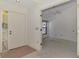 Open living area featuring tile flooring, a ceiling fan, and a doorway to a bedroom at 314 Pembroke Ln # 189, Venice, FL 34293