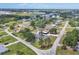 Aerial shot of homes in a quiet neighborhood, with mature trees lining the streets and well-maintained properties at 322 Linden Dr, Ellenton, FL 34222