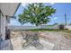 The backyard features a patio set on the stone pavers with a shed and white vinyl fence at 322 Linden Dr, Ellenton, FL 34222
