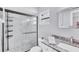 Bathroom features a new glass shower, marble tiling, and updated vanity at 322 Linden Dr, Ellenton, FL 34222