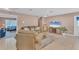 Inviting living room featuring a large TV and neutral decor at 322 Linden Dr, Ellenton, FL 34222
