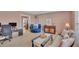 Comfortable living room with plush seating, stylish decor, and abundant natural light at 322 Linden Dr, Ellenton, FL 34222
