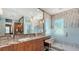 Bright bathroom with a large mirror, modern fixtures, and a walk-in shower at 3272 Bayou Rd, Longboat Key, FL 34228