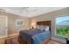 Comfortable bedroom boasts a ceiling fan, natural light, and decor at 3272 Bayou Rd, Longboat Key, FL 34228