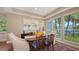 A dining room with hardwood floors, lots of natural light, and artwork at 3272 Bayou Rd, Longboat Key, FL 34228