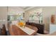 A dining room with hardwood floors, neutral colored walls, and artwork at 3272 Bayou Rd, Longboat Key, FL 34228