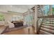 A dining room with hardwood floors, lots of natural light, and stairs at 3272 Bayou Rd, Longboat Key, FL 34228