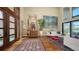 Home with a welcoming living room featuring wood floors, stairs, and lots of natural light at 3272 Bayou Rd, Longboat Key, FL 34228