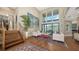 Bright living room features soaring ceilings, large windows, hardwood floors, and elegant furnishings at 3272 Bayou Rd, Longboat Key, FL 34228