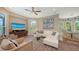 Open living room with hardwood floors, ample natural light, and comfortable seating at 3272 Bayou Rd, Longboat Key, FL 34228