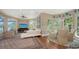 Open living room with hardwood floors, large windows, and a comfortable seating arrangement at 3272 Bayou Rd, Longboat Key, FL 34228