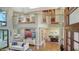 Open-concept living room with high ceilings, hardwood floors, and plenty of natural light at 3272 Bayou Rd, Longboat Key, FL 34228