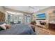 Beautiful main bedroom featuring a sitting area, ensuite office, and a blue patterned comforter at 3272 Bayou Rd, Longboat Key, FL 34228