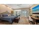 Spacious bedroom featuring natural light, a sitting area, and a work space at 3272 Bayou Rd, Longboat Key, FL 34228