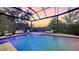 Beautiful pool area with a heated spa and expansive screened in lanai and waterfront views at 3272 Bayou Rd, Longboat Key, FL 34228