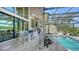 Wonderful outdoor space boasts a pool, dining area, and screened-in lanai at 3272 Bayou Rd, Longboat Key, FL 34228
