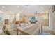 Bright dining area adjacent to kitchen with granite counters and stainless steel appliances at 3623 Square West Ln # 5, Sarasota, FL 34238