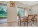 Cozy dining room with access to the outdoor screened patio at 3623 Square West Ln # 5, Sarasota, FL 34238