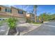 Beautiful townhome showing a two-car garage, lush landscaping, and a patterned brick driveway at 3623 Square West Ln # 5, Sarasota, FL 34238