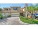 Charming townhouse featuring a two-car garage, a patterned driveway and lush landscaping at 3623 Square West Ln # 5, Sarasota, FL 34238