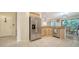 Spacious kitchen with stainless steel refrigerator and access to dining area at 3623 Square West Ln # 5, Sarasota, FL 34238