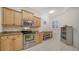 Bright kitchen with modern appliances, cabinets, and granite countertops at 3623 Square West Ln # 5, Sarasota, FL 34238