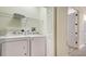 Laundry room featuring a washer, dryer, storage shelf and a doorway at 3623 Square West Ln # 5, Sarasota, FL 34238