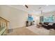Cozy living room with a ceiling fan, a sofa, and natural light streaming in through the window at 3623 Square West Ln # 5, Sarasota, FL 34238