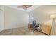 Bright office space with a desk, chair, cabinets, and a ceiling fan at 3623 Square West Ln # 5, Sarasota, FL 34238