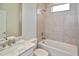 This bathroom features a shower over tub and marble countertops at 3812 Wenona Dr, North Port, FL 34288