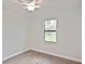 Bedroom featuring a window view and ceiling fan at 3812 Wenona Dr, North Port, FL 34288
