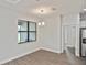 Bright dining area with modern chandelier and large window at 3812 Wenona Dr, North Port, FL 34288
