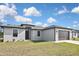 Charming single-story home with a well-kept lawn and attached two-car garage at 3812 Wenona Dr, North Port, FL 34288