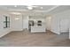 Spacious living room leading to a modern kitchen with stainless appliances at 3812 Wenona Dr, North Port, FL 34288