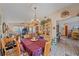 Elegant dining room featuring a decorative chandelier, and access to the living area with tile flooring throughout at 4053 Lancaster Dr, Sarasota, FL 34241