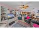 Inviting living room featuring a ceiling fan and an open layout leading into the kitchen at 4053 Lancaster Dr, Sarasota, FL 34241