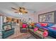 Bright living room showcasing tile flooring, comfortable seating, and views into the kitchen at 4053 Lancaster Dr, Sarasota, FL 34241