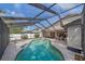 Sparkling screened-in pool offering ample space for relaxation and outdoor enjoyment at 4053 Lancaster Dr, Sarasota, FL 34241