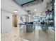 Modern bar area with ocean view and sleek design featuring glass racks and ample storage and serving space at 415 L Ambiance Dr # D306, Longboat Key, FL 34228