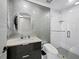 Modern bathroom with stylish tiles, modern vanity, illuminated mirror, and glass-enclosed shower at 415 L Ambiance Dr # D306, Longboat Key, FL 34228