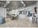 Dining area with modern light fixture and bar in the background perfect for entertaining with luxurious finishes at 415 L Ambiance Dr # D306, Longboat Key, FL 34228
