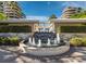 Picturesque fountain surrounded by lush greenery and manicured landscaping in a condo community at 415 L Ambiance Dr # D306, Longboat Key, FL 34228