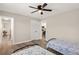 Bright bedroom features hardwood floors, closet and open view to kitchen at 420 63Rd St # B East, Holmes Beach, FL 34217