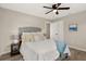 Relaxing bedroom retreat complete with a ceiling fan, wood look flooring, and neutral decor at 420 63Rd St # B East, Holmes Beach, FL 34217