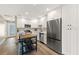 Bright kitchen featuring white cabinets, stainless steel appliances, and a butcher block island with seating at 420 63Rd St # B East, Holmes Beach, FL 34217